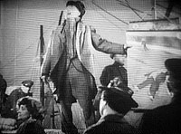 The street-singer's moritat, frame enlargement from the 1931 Pabst movie